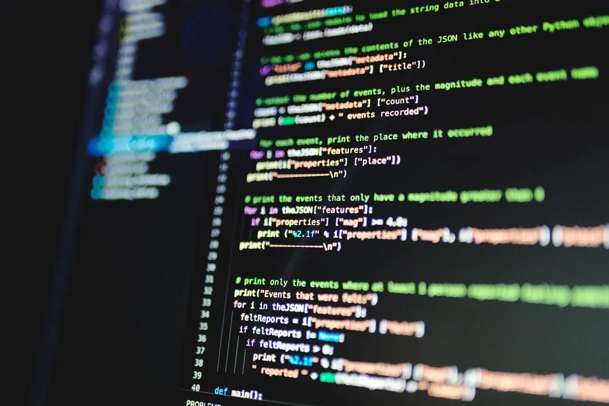 A developer writing code on a computer screen