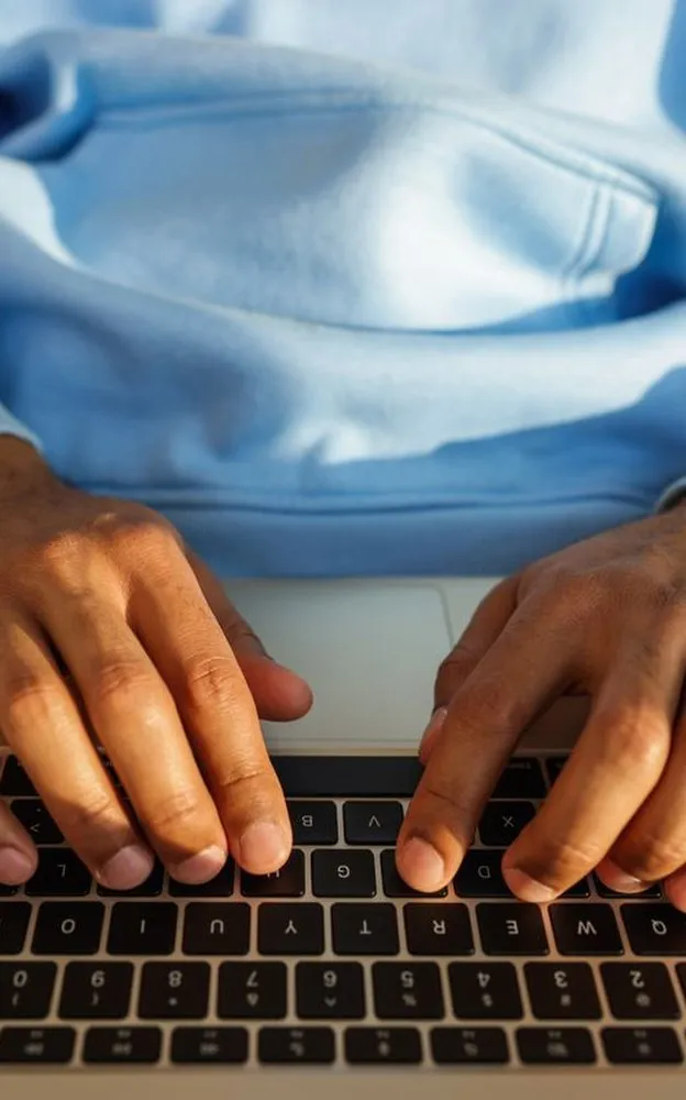 Hands typing on a laptop, ready to reply to your message